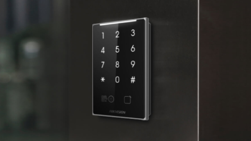 Hikvision keypad access reader mounted beside a door